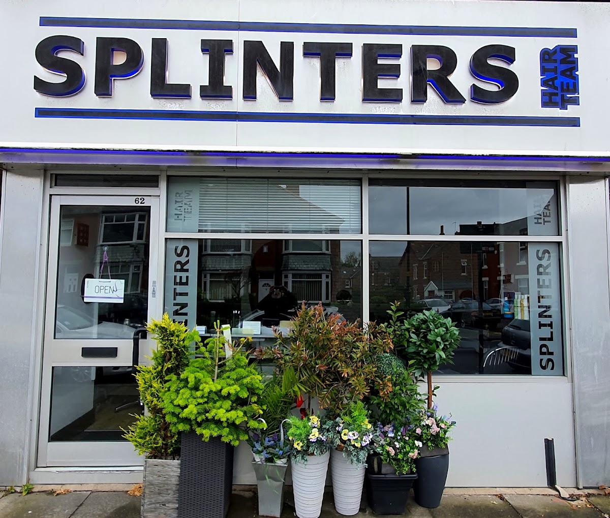 The Splinters shopfront on a bright day with potted plants
