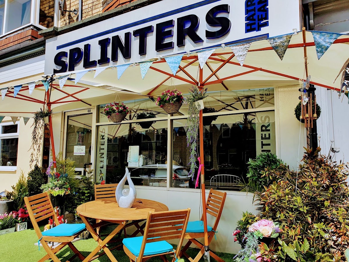 Splinters shopfront dressed with bunting, hanging baskets and a water feature