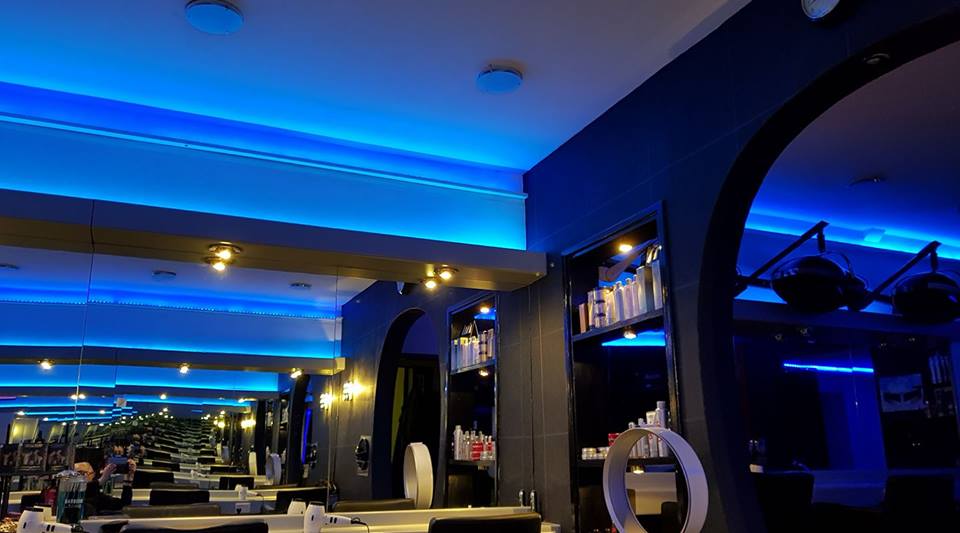 The Splinters salon interior lit with deep blue lighting